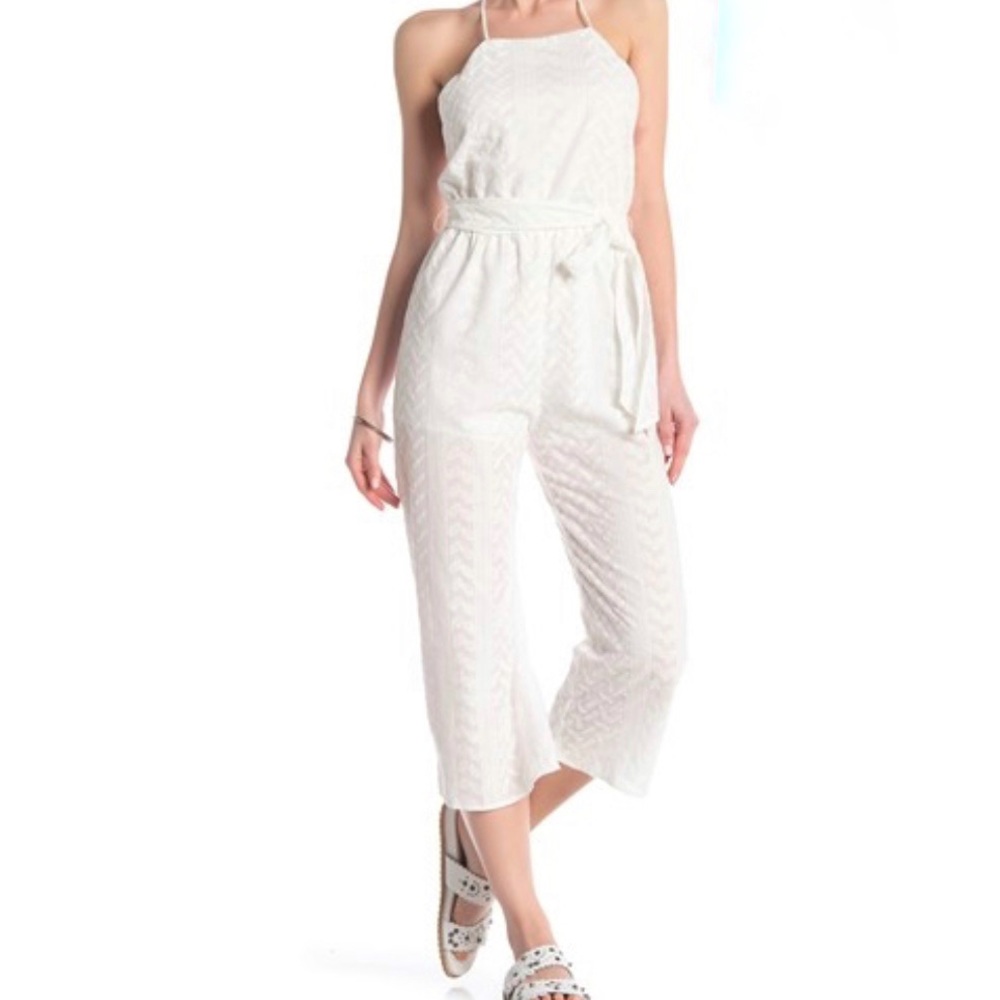 Brand is AAKAA off white NWOT jumpsuit size Medium